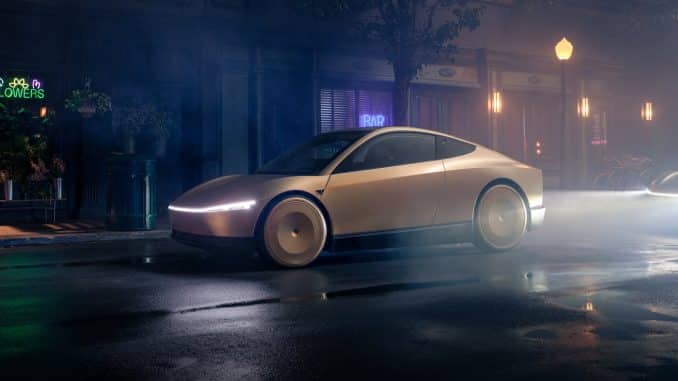 Tesla Cybercab beige vu de trois quarts avant, de nuit dans une rue