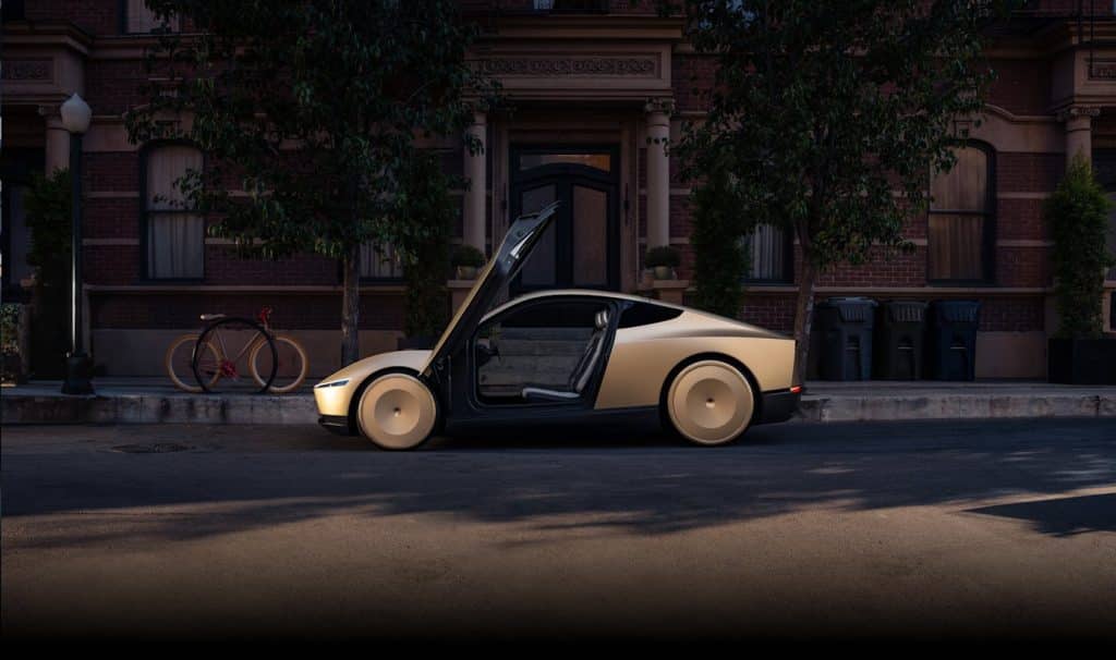 Tesla Cybercab garé, vu de profil, portes ouvertes